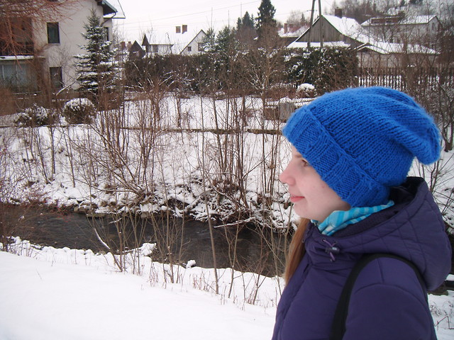 By the river.