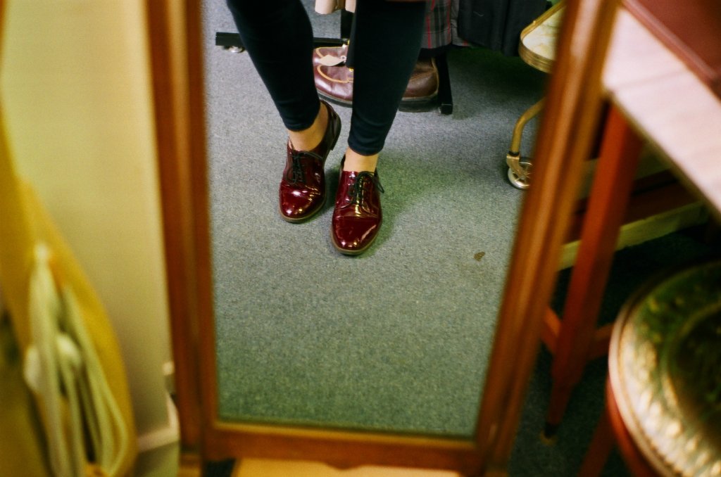 At a vintage shop, in the mirror