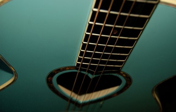 hearts on his guitar 