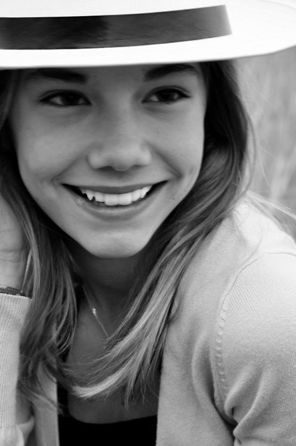 a girl in a hat