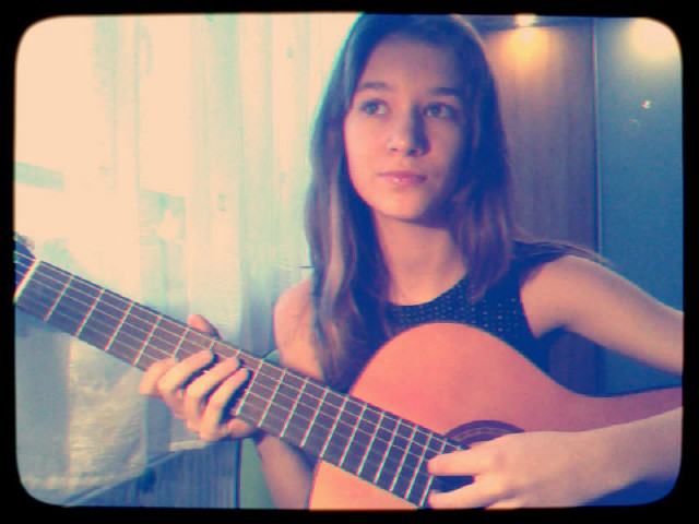 With a guitar